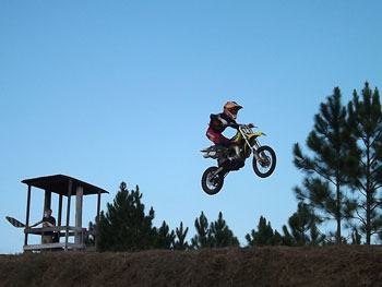 FLMN - Beck's Tech Racing rider Brett Meade checkered flag.